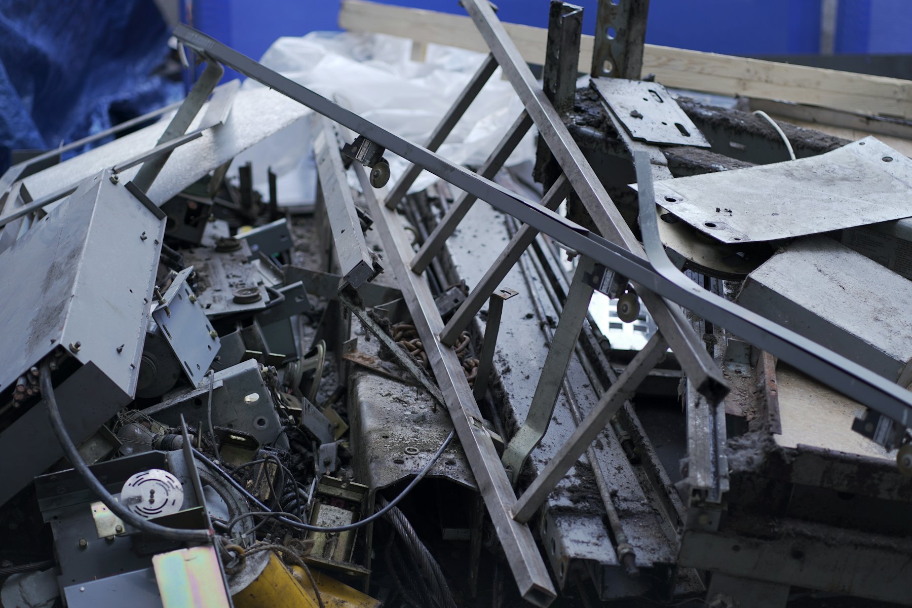 Pile of industrial sheet metal and angle iron offcuts